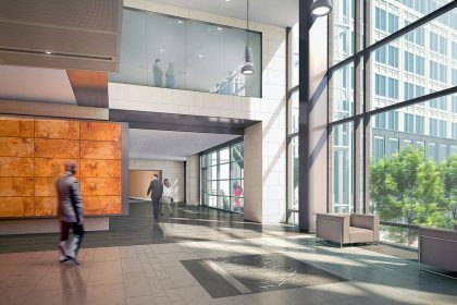 man in black jacket walking on white tiled floor