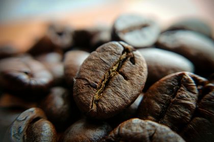 A pile of coffee beans sitting on top of a table