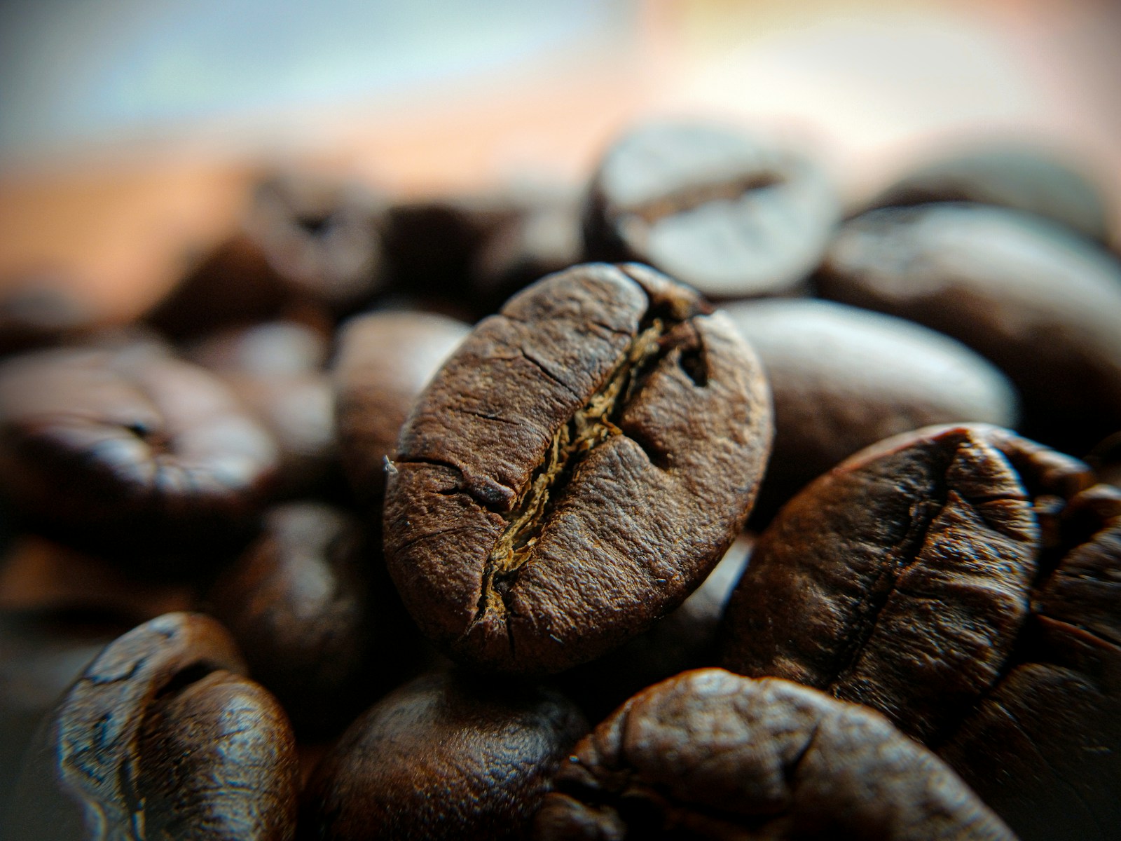 A pile of coffee beans sitting on top of a table
