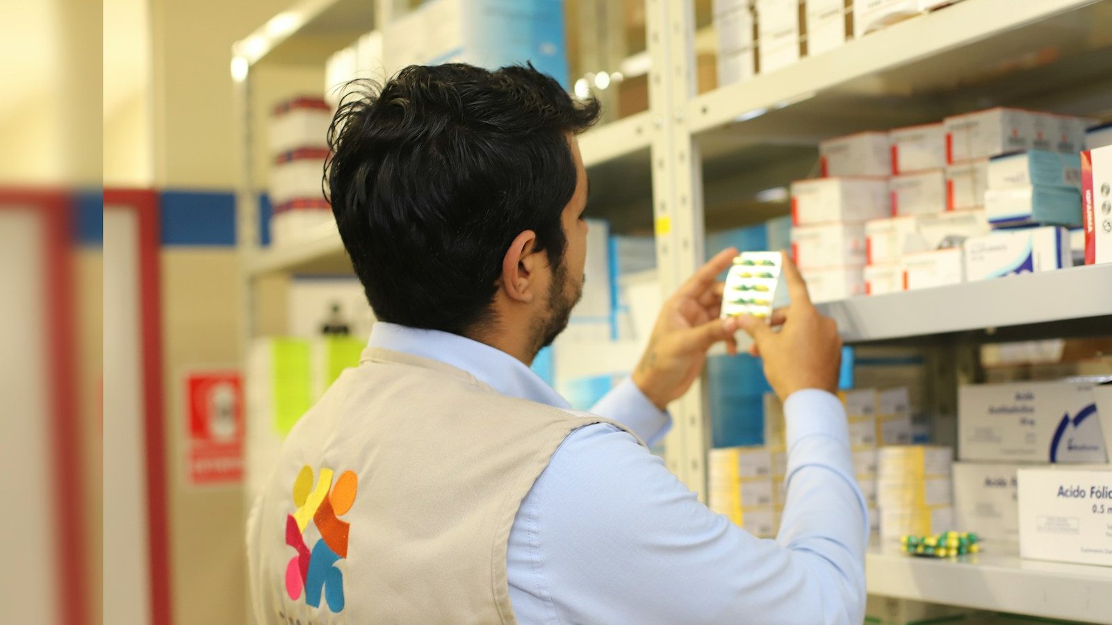 a man taking a picture of a product in a store