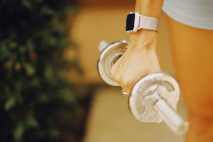 a close up of a person holding a water bottle