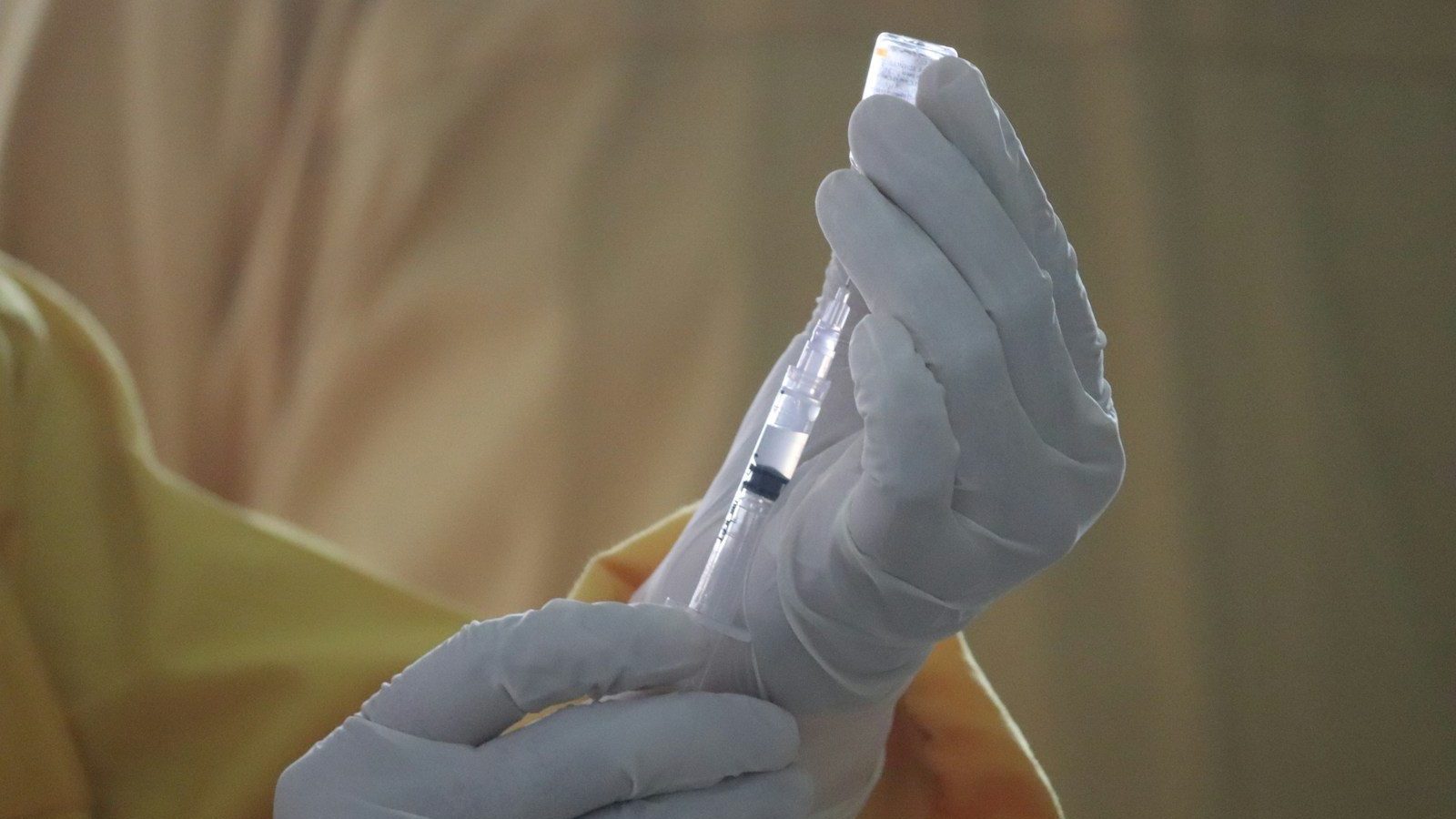 person holding white plastic tube