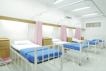 empty hospital bed inside room