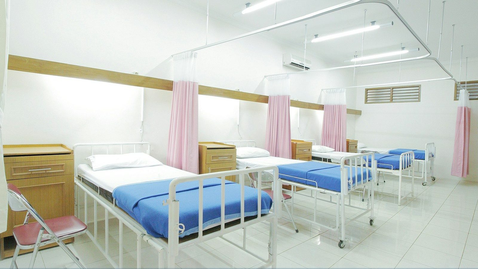 empty hospital bed inside room